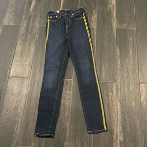 Women’s True Religion brand jeans, are extra skinny and runs smaller.